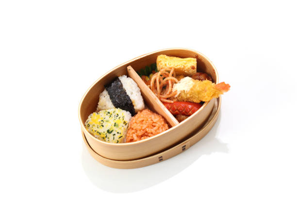 rice ball lunch in the wooden lunch box Pictured rice ball lunch in the wooden lunch box. cryptomeria stock pictures, royalty-free photos & images