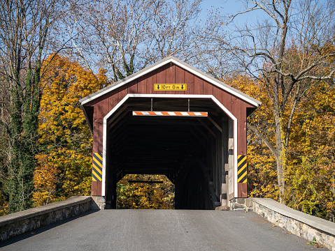 Autumn scene of Amish Red Covered Bridge in Rural Lancaster County, Pennsylvania