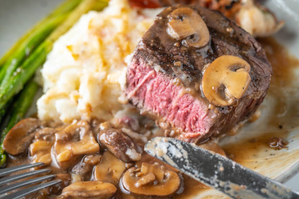 istock eating sruf and turf, tenderloin steak and lobster tail 1285529052