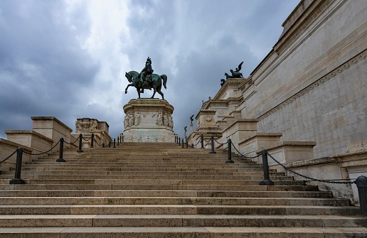 Rome, Italy, May 6, 2018: View of the Vittorio Emmanuel monument, improperly called Altare della Patria (Altar of the Fatherland), under cloudy sky. It is a monument built in honor of Victor Emmanuel II, the first king of a unified Italy.