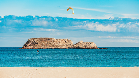 This is Kite Foiling at Praia do Martinhal, Sagres, Portugal\nKite surfing and Kite boarding as well as foiling are getting more and more popular besides surfing. Portugal is the place-to-be in Europe to be able to do it the whole year.