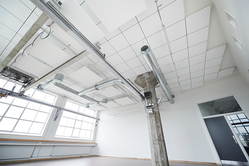 Industrial building rebuild for office purpose. Air conditioning and equipment visible