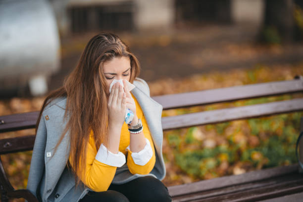 istock Sick young woman with cold and flu 1285535457
