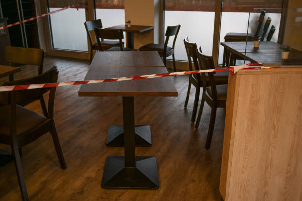 istock Warning tape blocks a cafe, which has to close during lockdown due to coronavirus pandemic 1285539062
