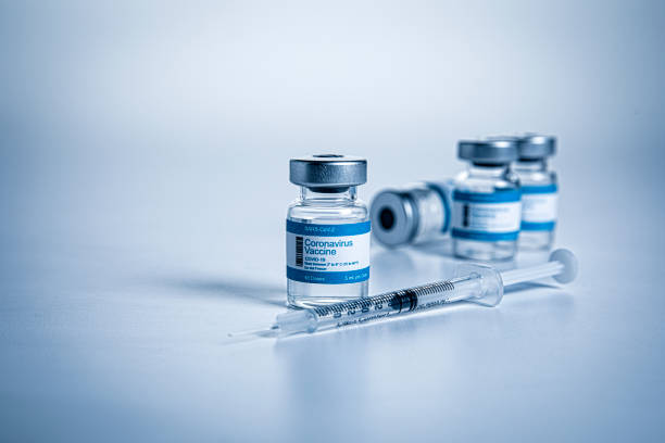 istock Coronavirus vaccine vials in hospital on Blue Background 1285539262