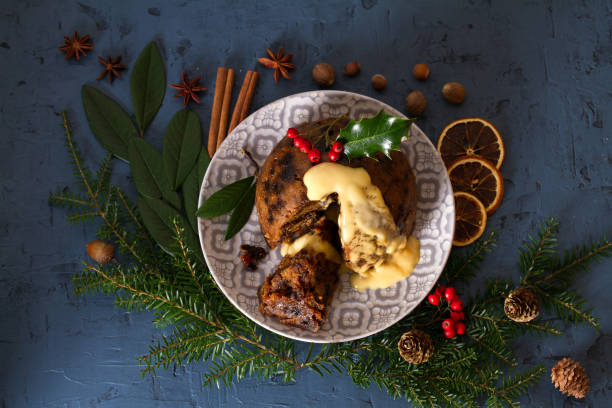 istock Richly spiced Christmas pudding cake with custard 1285540888