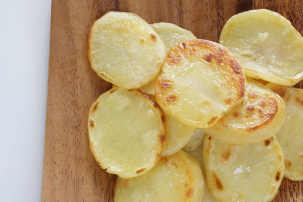 istock fried thick cut potato on wooden plate 1285541214