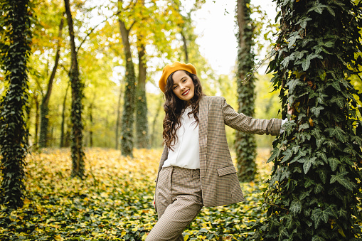 Portrait of young fashion woman enjoying in nature