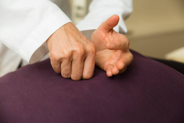 istock Woman doctor massages a patient's back 1285543762