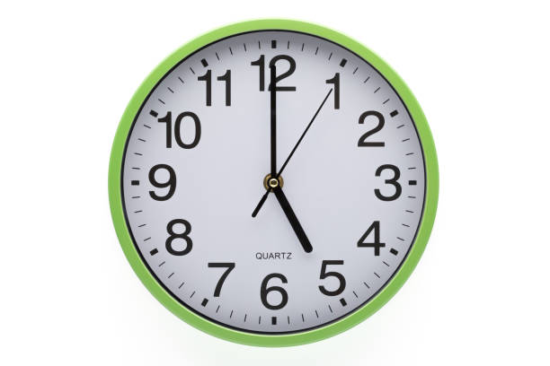 istock Five o'clock. Wall clock showing time on white background. Clipping path included. 1285545568