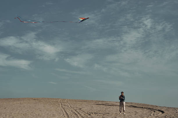 istock The girl launches a kite. Camping, hobby. 1285545754