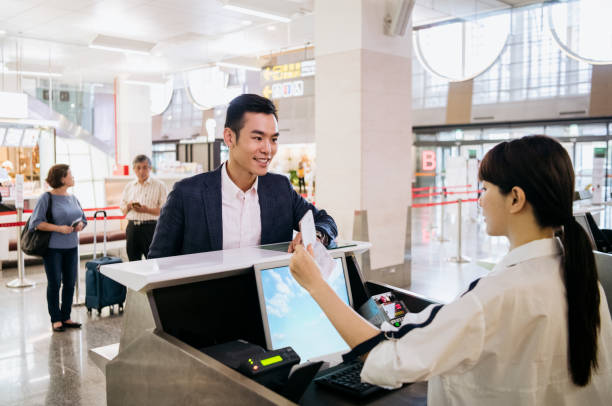 istock Businessman at airport check-in counter 1285546614