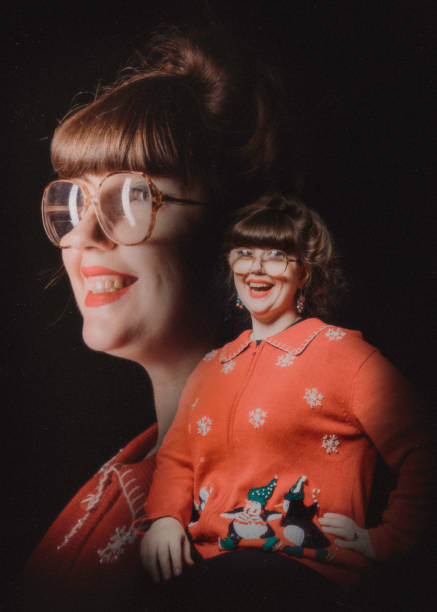 Christmas Ugly Sweater Retro Portrait A Caucasian adult women celebrates the holiday taking a portrait wearing an "ugly" Christmas sweater.  Vintage styled portrait in 1980's style. 1980 photos stock pictures, royalty-free photos & images
