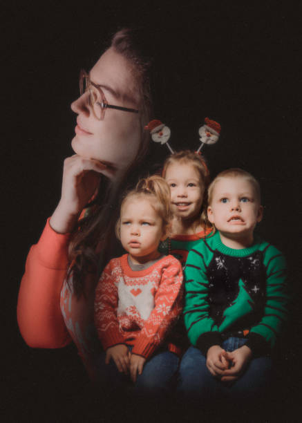 Christmas Ugly Sweater Retro Portrait Family A Caucasian adult women and her children celebrate the holiday taking a portrait wearing an "ugly" Christmas sweater.  Vintage styled portrait in 1980's style. ugliness photos stock pictures, royalty-free photos & images