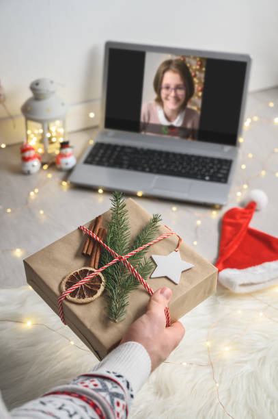 istock Christmas online congratulations. Remote communication on Christmas Eve at home, lockdown coronavirus. 1285548035