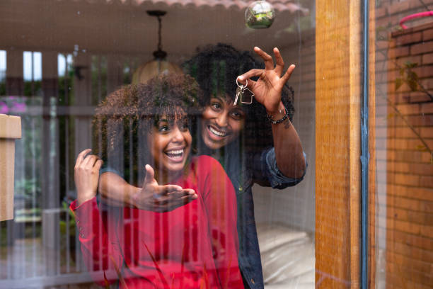 istock Afro-Latin ethnic couple embracing inside their new home. 1285550762
