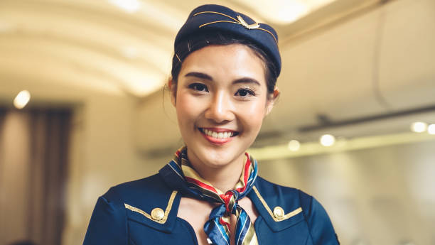 istock Cabin crew or air hostess working in airplane 1285568024