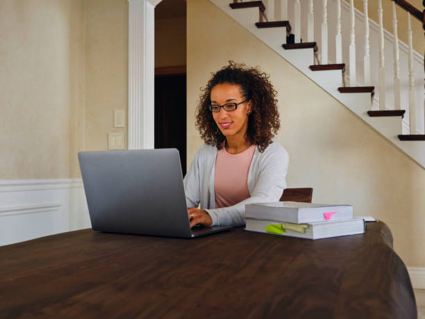 istock Woman Studying Online in a Home 1285570291