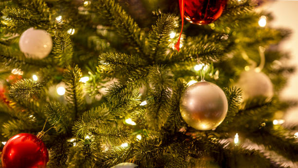 istock Silver and red baubles multiple in Christmas tree with lights 1285573931