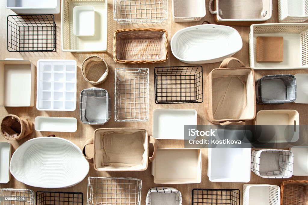 Flat lay of Marie Kondo's storage boxes, containers and baskets with different sizes and shapes Flat lay of Marie Kondo's storage boxes, containers and baskets with different sizes and shapes for tidying up wardrobe. KonMari method organizer boxes set. Closet organizing concept. Organization Stock Photo