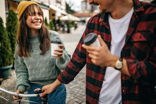 istock Friends walking on city streets and pushing bicycle 1285581844