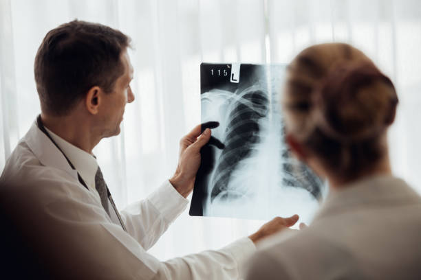 istock Doctor and patient looking at x-ray 1285583072