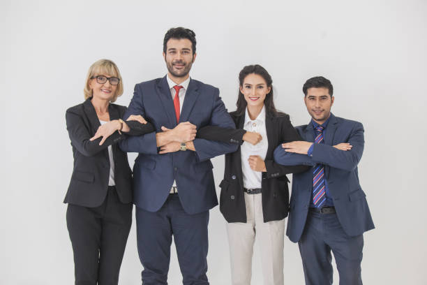 istock Group of business holding hands, Young business people are holding hands. Unity and teamwork concept. 1285583708