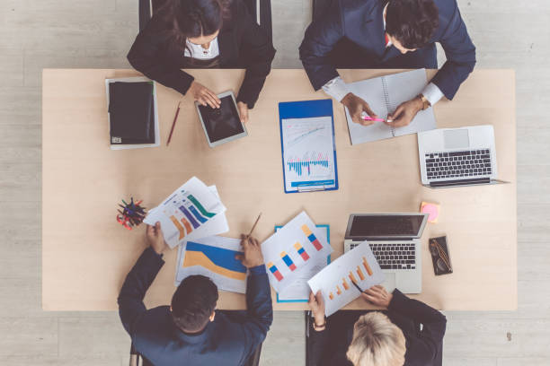 istock Marketing Analysis Accounting Team Teamwork Business Meeting Concept. Top view in office while people having a meeting 1285583712