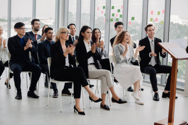 istock People Meeting Conference Seminar Audience Concept. business workshop and presentation. Audience at the conference room. 1285588069