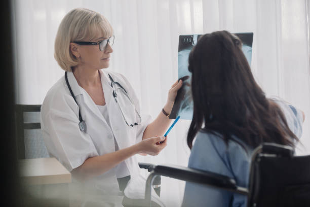 istock Doctor and patient looking at x-ray 1285588394