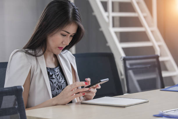 istock Close up of a woman using mobile smart phone 1285589251