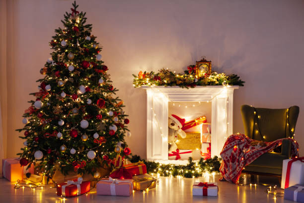 christmas tree pine with gifts light garlands interior decor new year - spruce tree fotos imagens e fotografias de stock