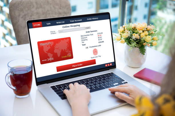 istock woman using online shopping application on computer laptop in cafe 1285590238