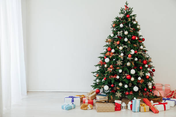 istock Christmas tree with gifts decor New Year interior postcard 1285591204