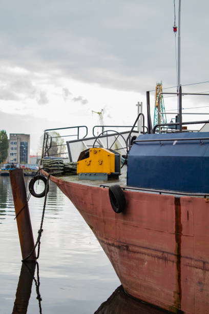 istock Red ship in cargo port in the morning 1285595857