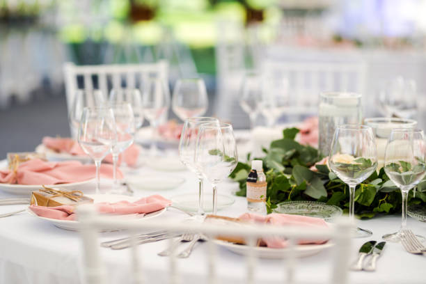 istock Luxury wedding table decoration in pink and white. Special event table set up. Fresh flower decoration. 1285597072