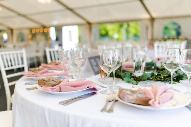 istock Luxury wedding table decoration in pink and white. Special event table set up. Fresh flower decoration. 1285597084