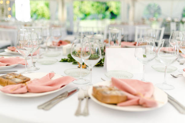 istock Luxury wedding table decoration in pink and white. Special event table set up. Fresh flower decoration. 1285597090
