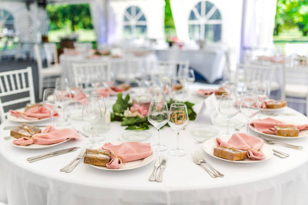 istock Luxury wedding table decoration in pink and white. Special event table set up. Fresh flower decoration. 1285597091