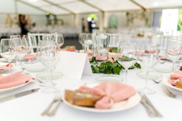 istock Luxury wedding table decoration in pink and white. Special event table set up. Fresh flower decoration. 1285597101