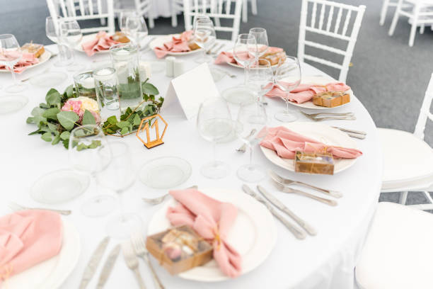 istock Luxury wedding table decoration in pink and white. Special event table set up. Fresh flower decoration. 1285597103