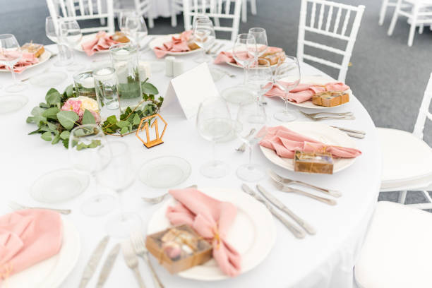 Luxury wedding table decoration in pink and white. Special event table set up. Fresh flower decoration. stock photo