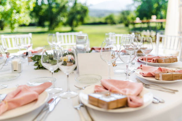 istock Luxury wedding table decoration in pink and white. Special event table set up. Fresh flower decoration. 1285597111