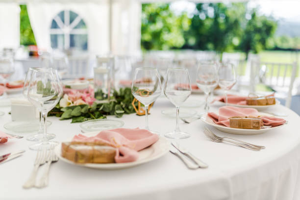 istock Luxury wedding table decoration in pink and white. Special event table set up. Fresh flower decoration. 1285597113
