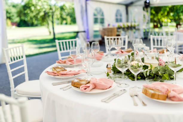 istock Luxury wedding table decoration in pink and white. Special event table set up. Fresh flower decoration. 1285597119