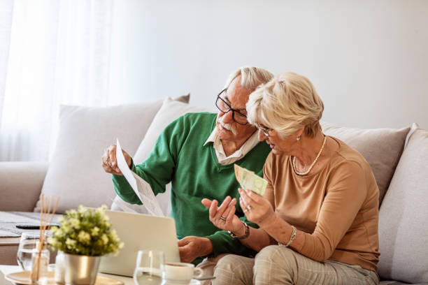 istock Senior couple brainstorming the solution to a financial problem 1285597383
