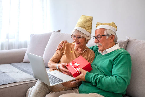 istock Senior couple on video call for Christmas greetings. 1285597389