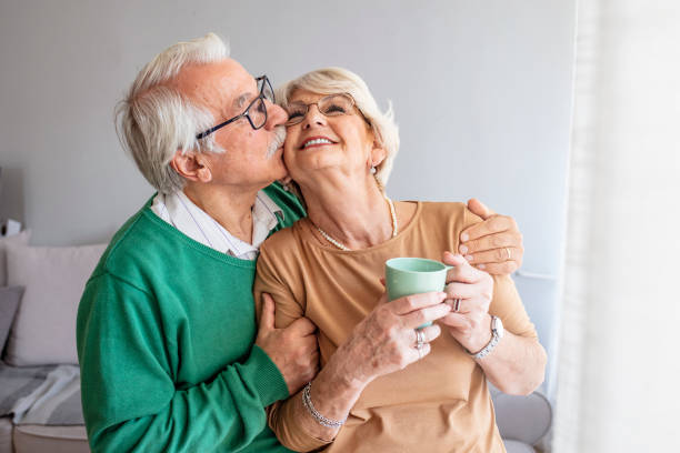 istock Happy pensioner couple enjoying time at home 1285598100
