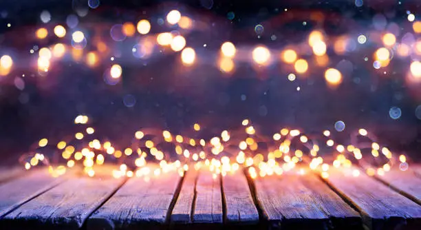 Abstract Christmas Background - Wooden Table With Bokeh String Lights