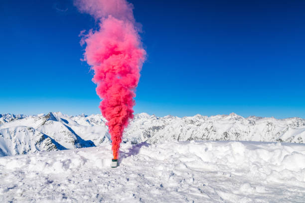 istock Smoke bomb with red smoke in the mountains 1285602036